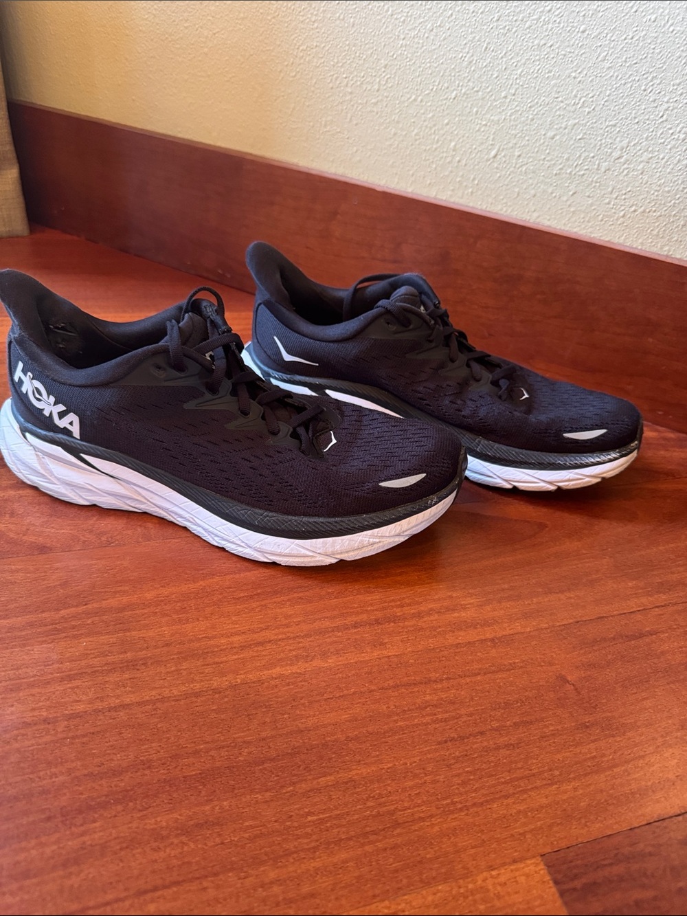 Hoka Woman’s Black and White Clifton 8